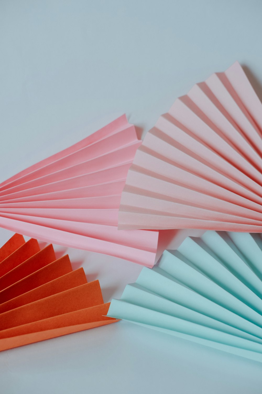 a close up of a paper fan on a table