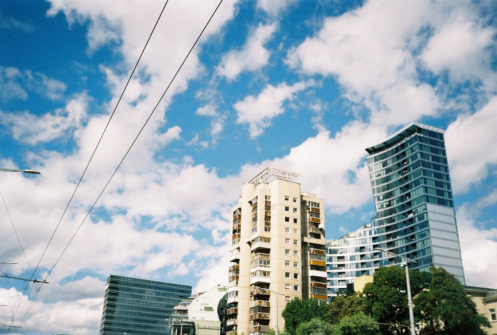 a city street with tall buildings and power lines