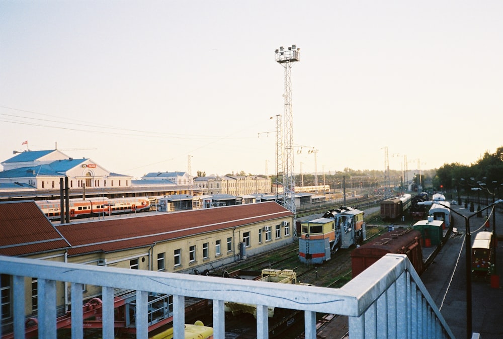 a view of a train station from a balcony
