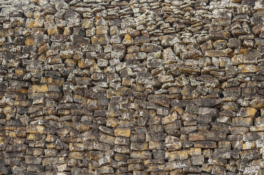 a stone wall made of rocks and cement