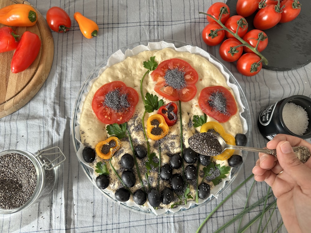 a plate of food with tomatoes and olives