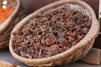 a basket full of dried star anisets on a table