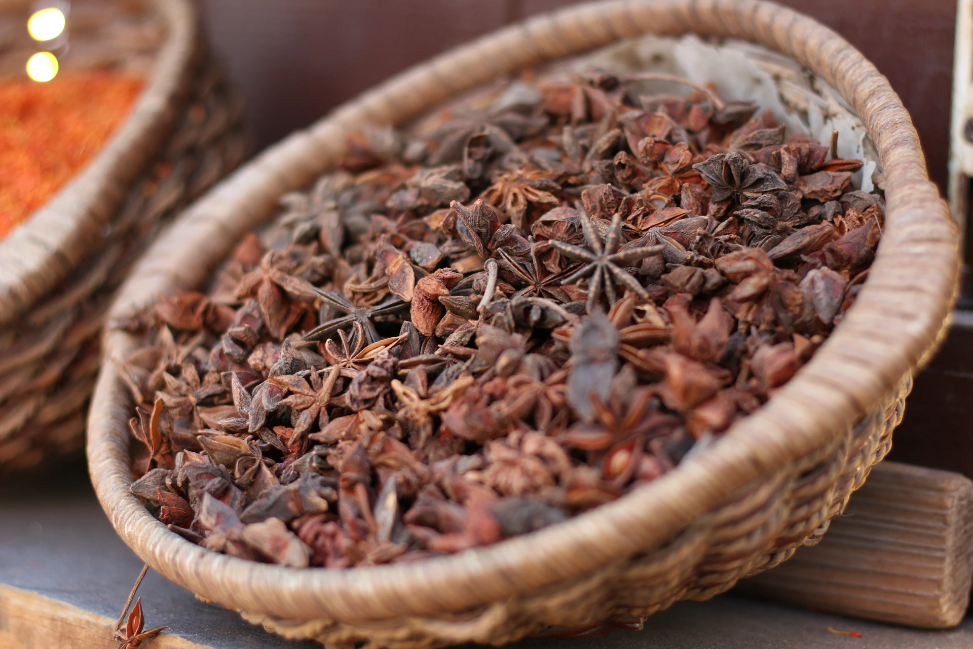 a basket full of dried star anisets on a table
