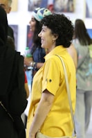 A vibrant scene from a lively exhibition with guests engaging and smiling.