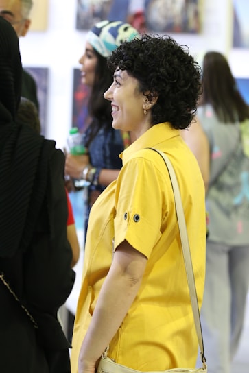 A collage of past exhibition guests smiling and interacting during different years.
