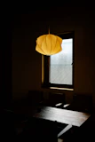 Modern pendant lights casting soft light over a dining table