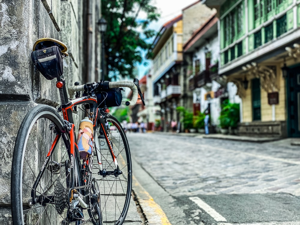 a bicycle parked on the side of a building