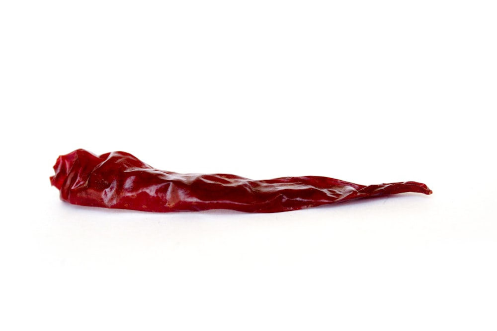 a red pepper on a white background
