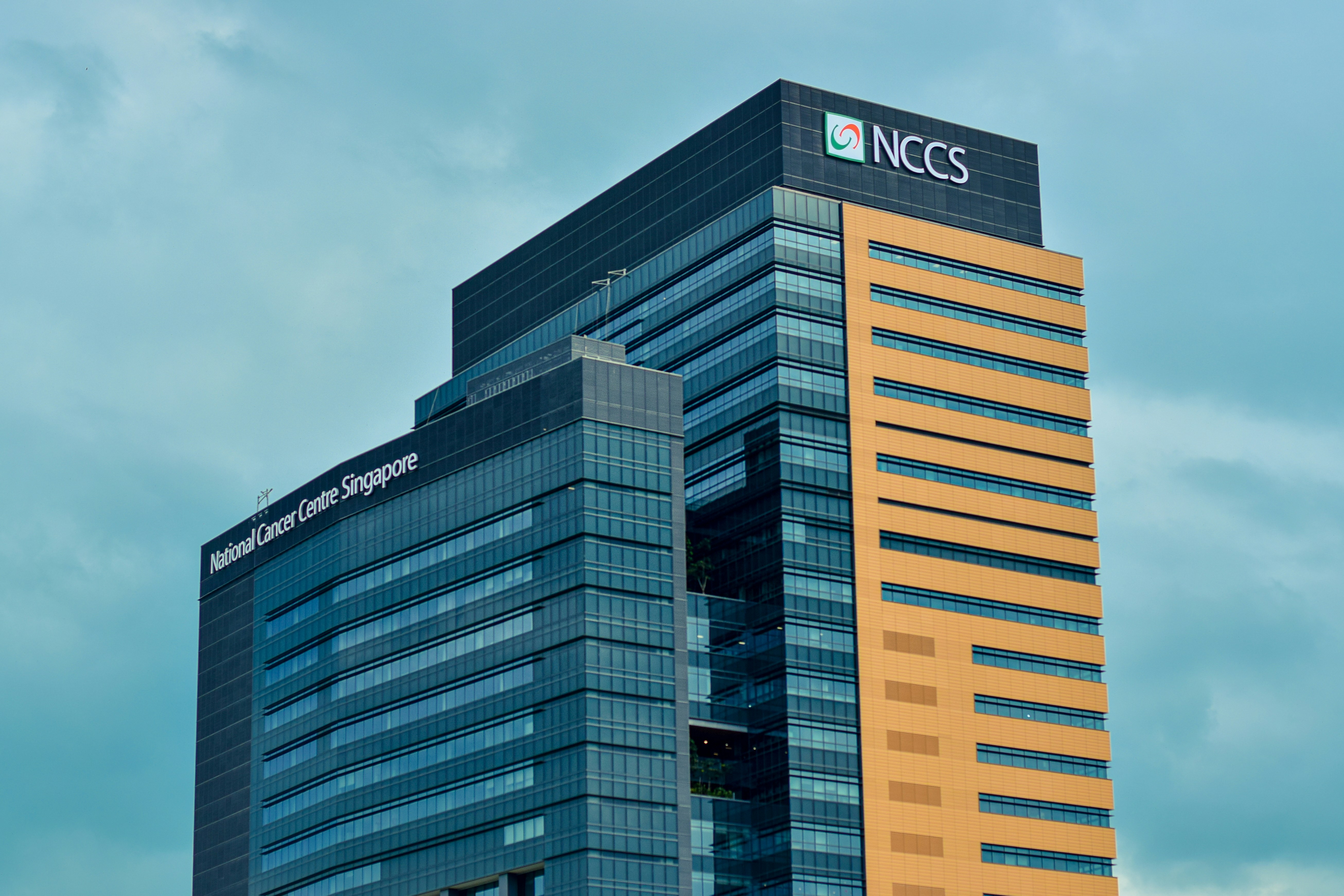 a very tall building with a sky background