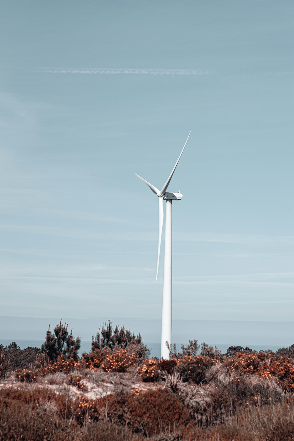 a wind turbine in the middle of a field