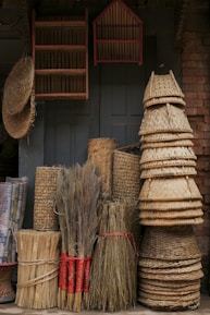 a pile of brooms sitting next to each other