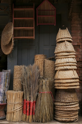 a pile of brooms sitting next to each other