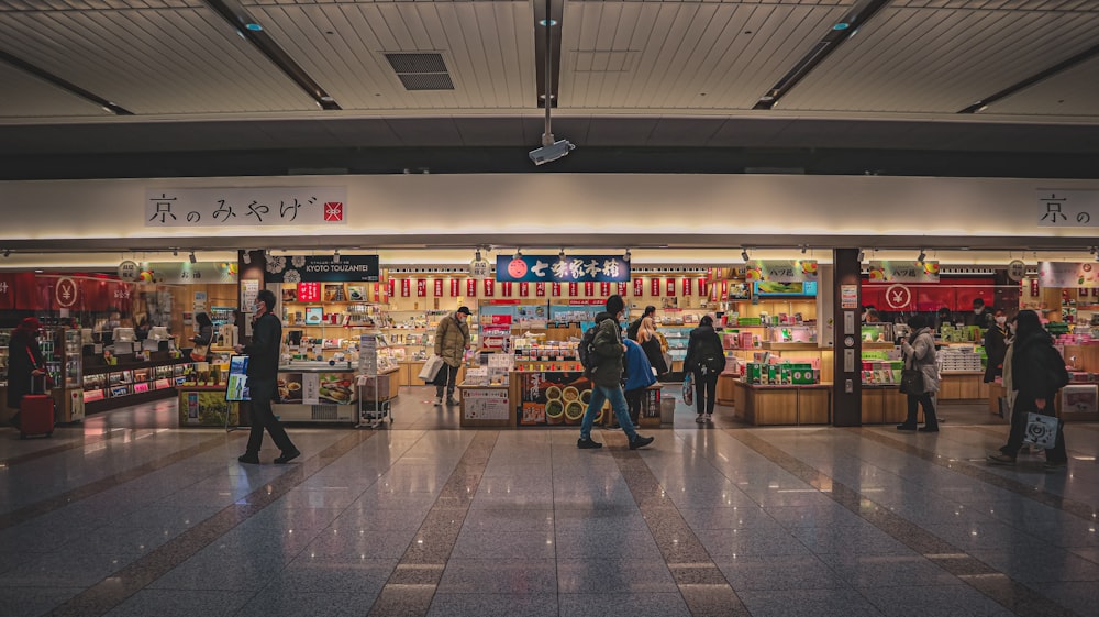 a group of people standing in front of a store