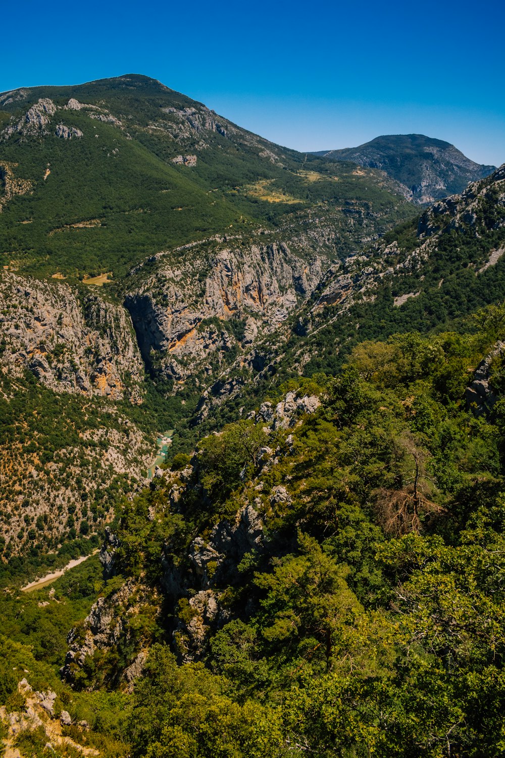 a view of a valley with a river running through it