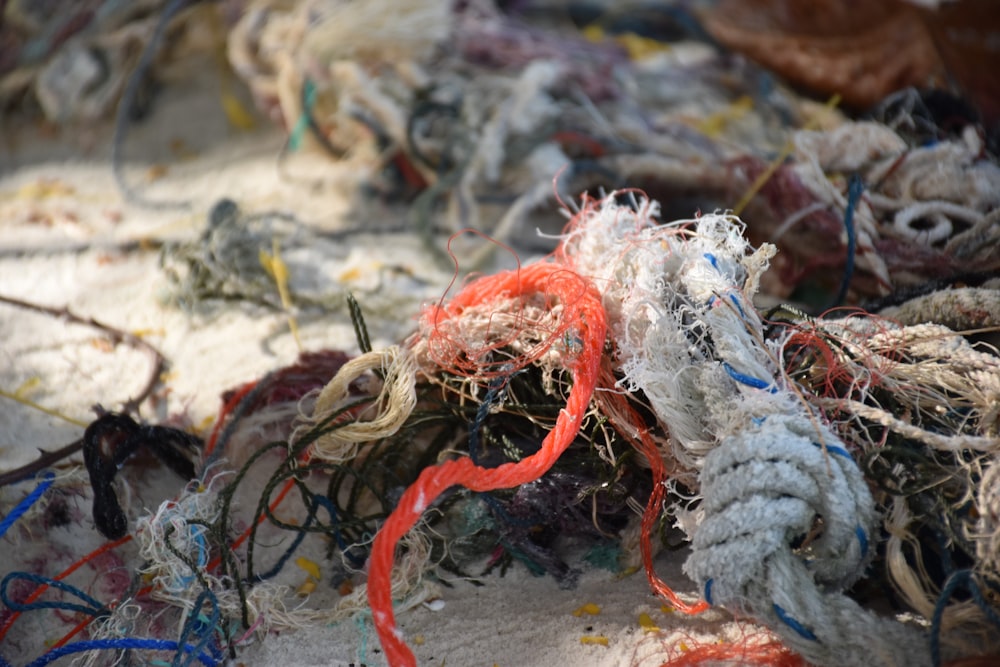 a pile of rope and ropes on the beach