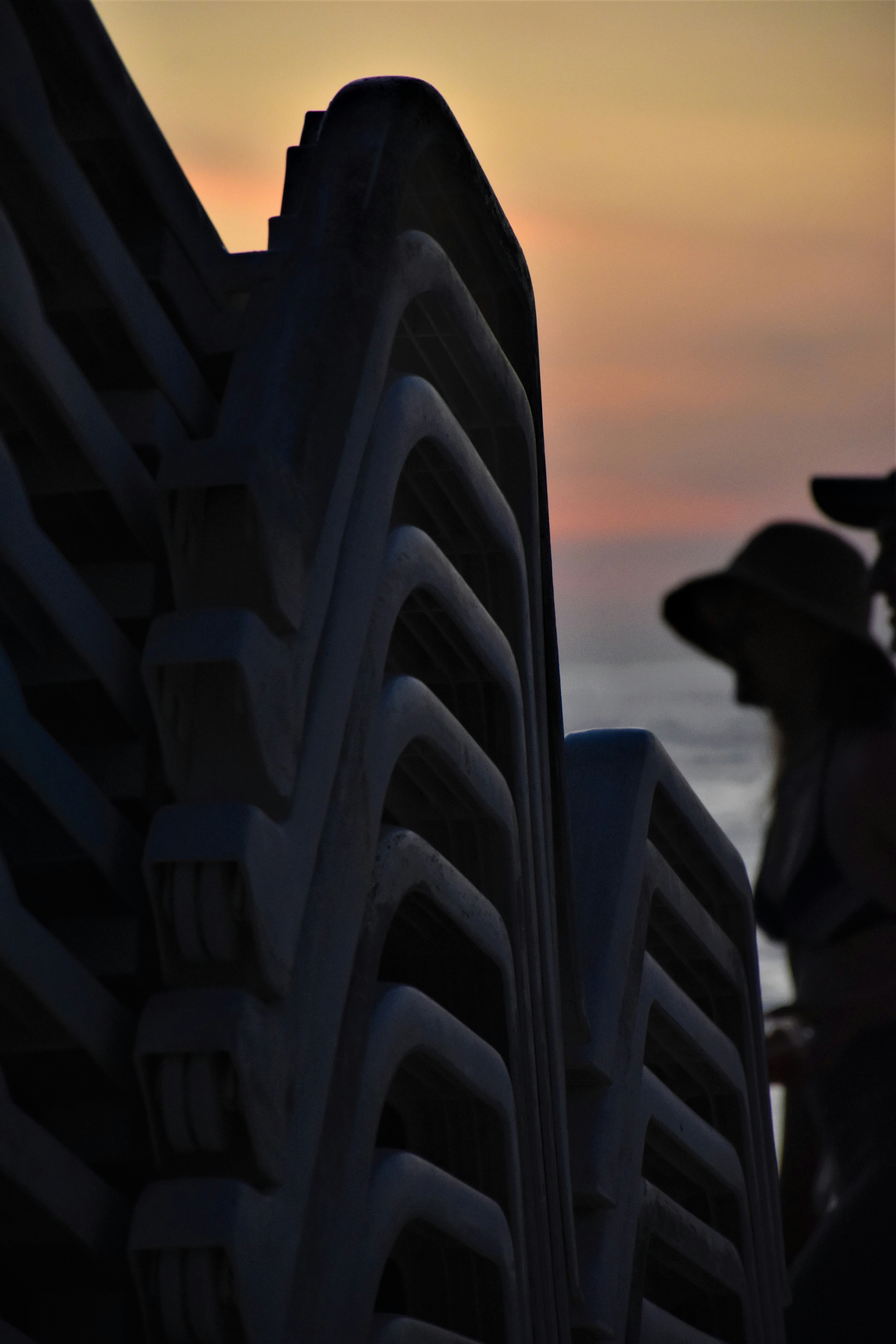 a woman standing next to a large cruise ship
