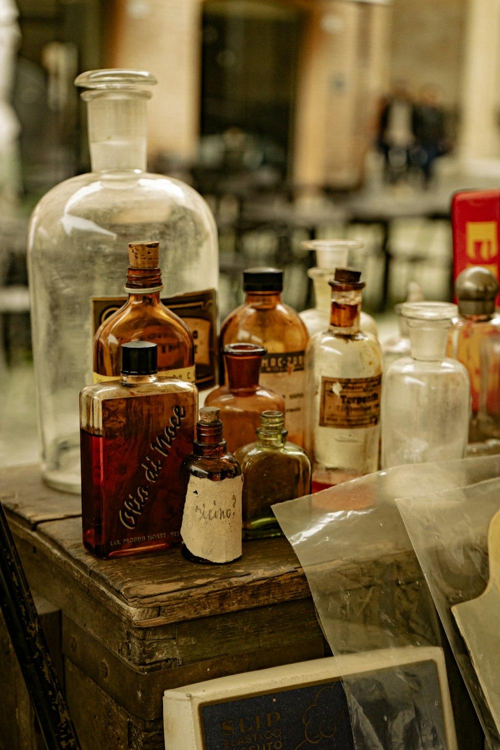 a wooden table topped with lots of bottles