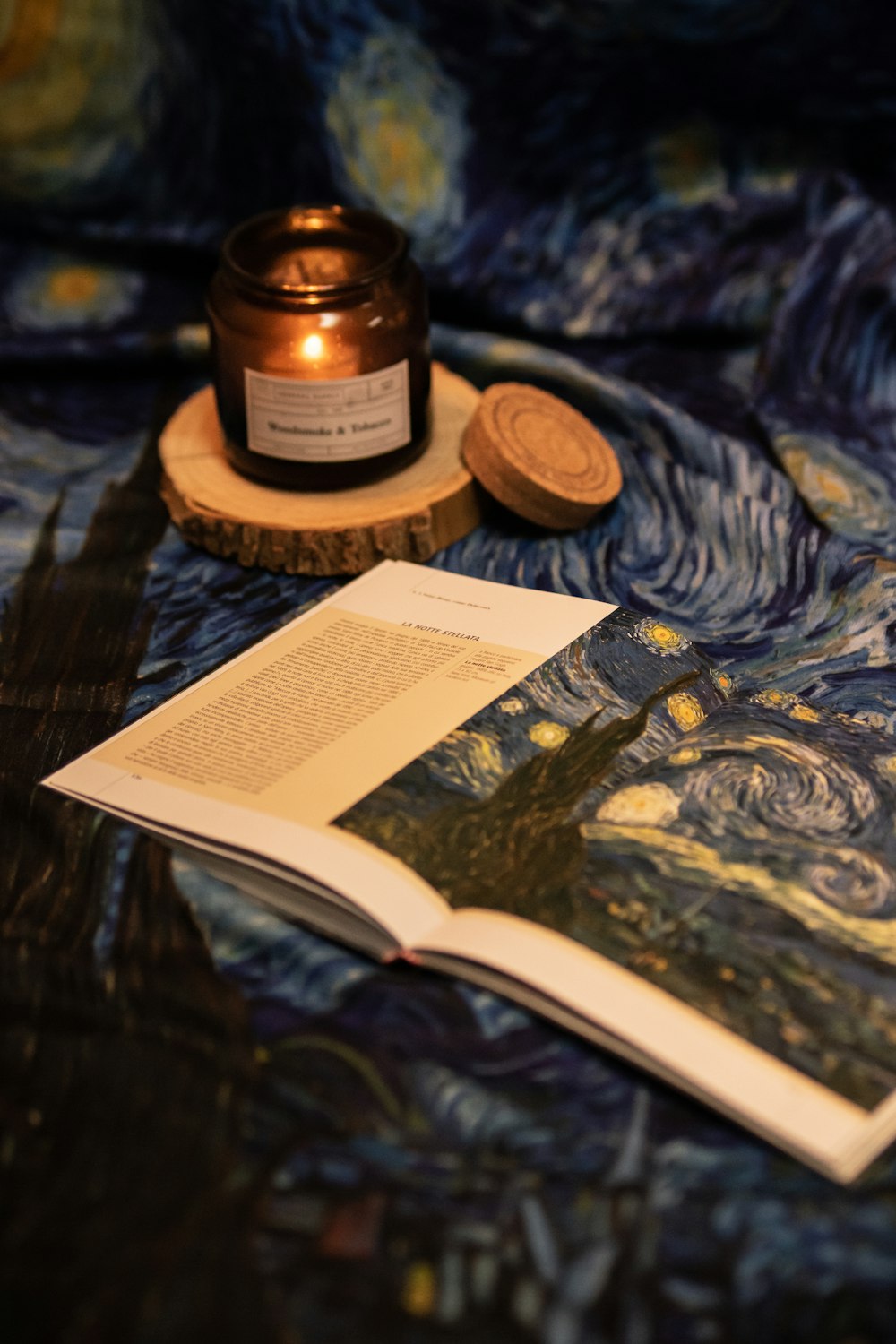 a candle and a book on a table