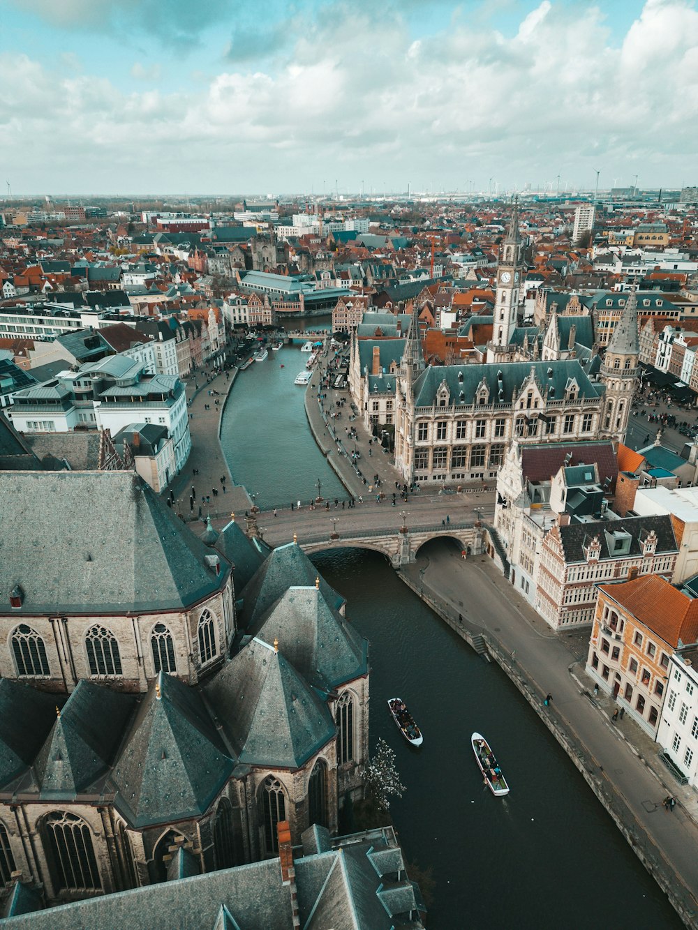 a river running through a city next to tall buildings