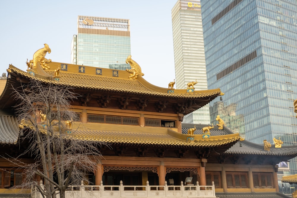 a tall building with a golden roof in a city