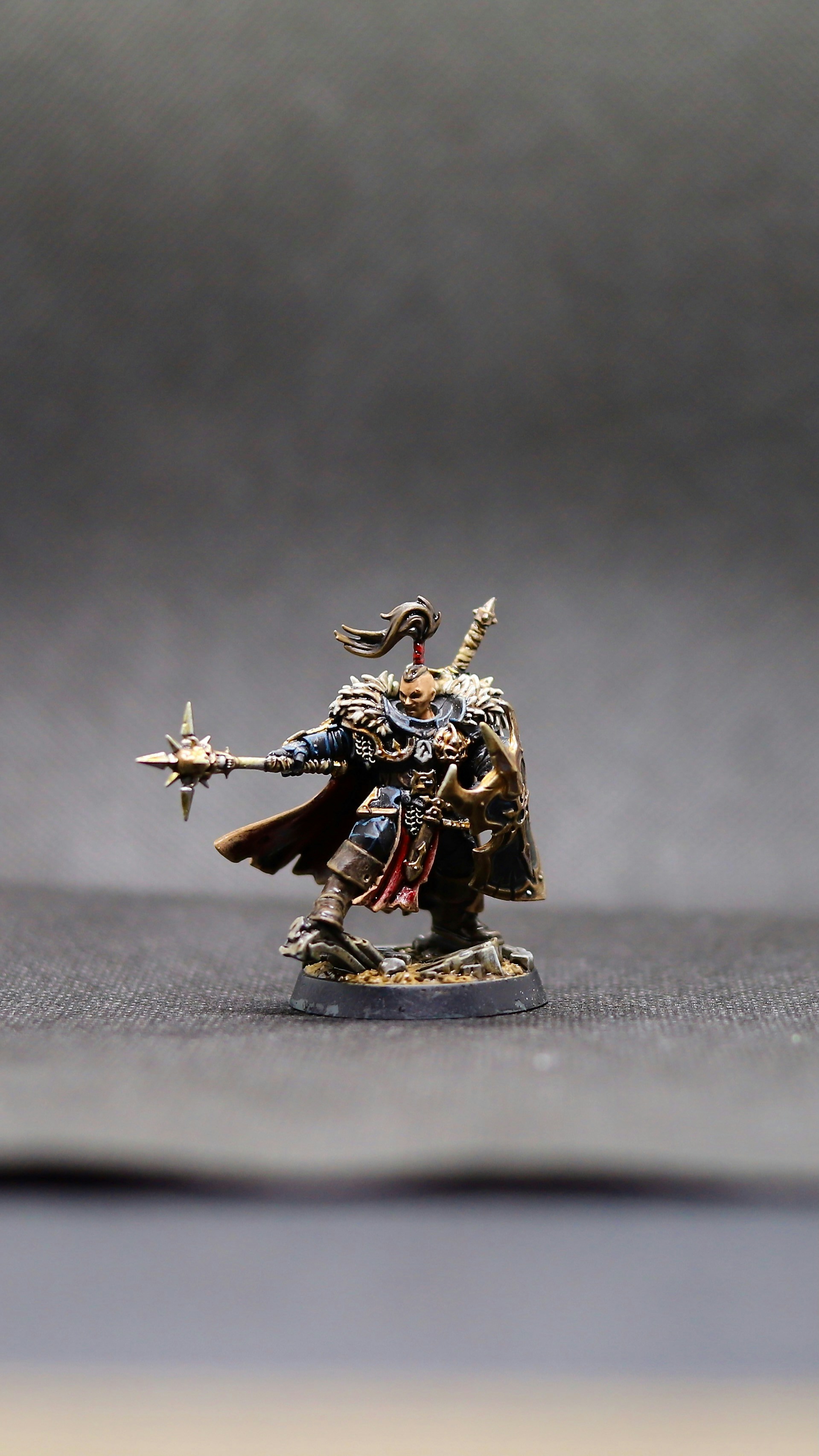 a toy figurine of a man with a sword