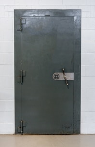 A secure vault door with digital code overlay representing asset protection.