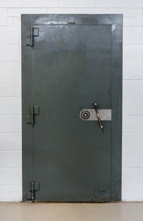 Elegant vault door symbolizing secure physical asset storage.