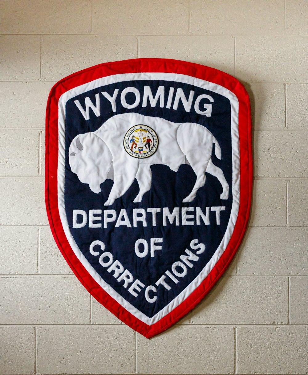a sign on a wall that says wyoming department of corrections
