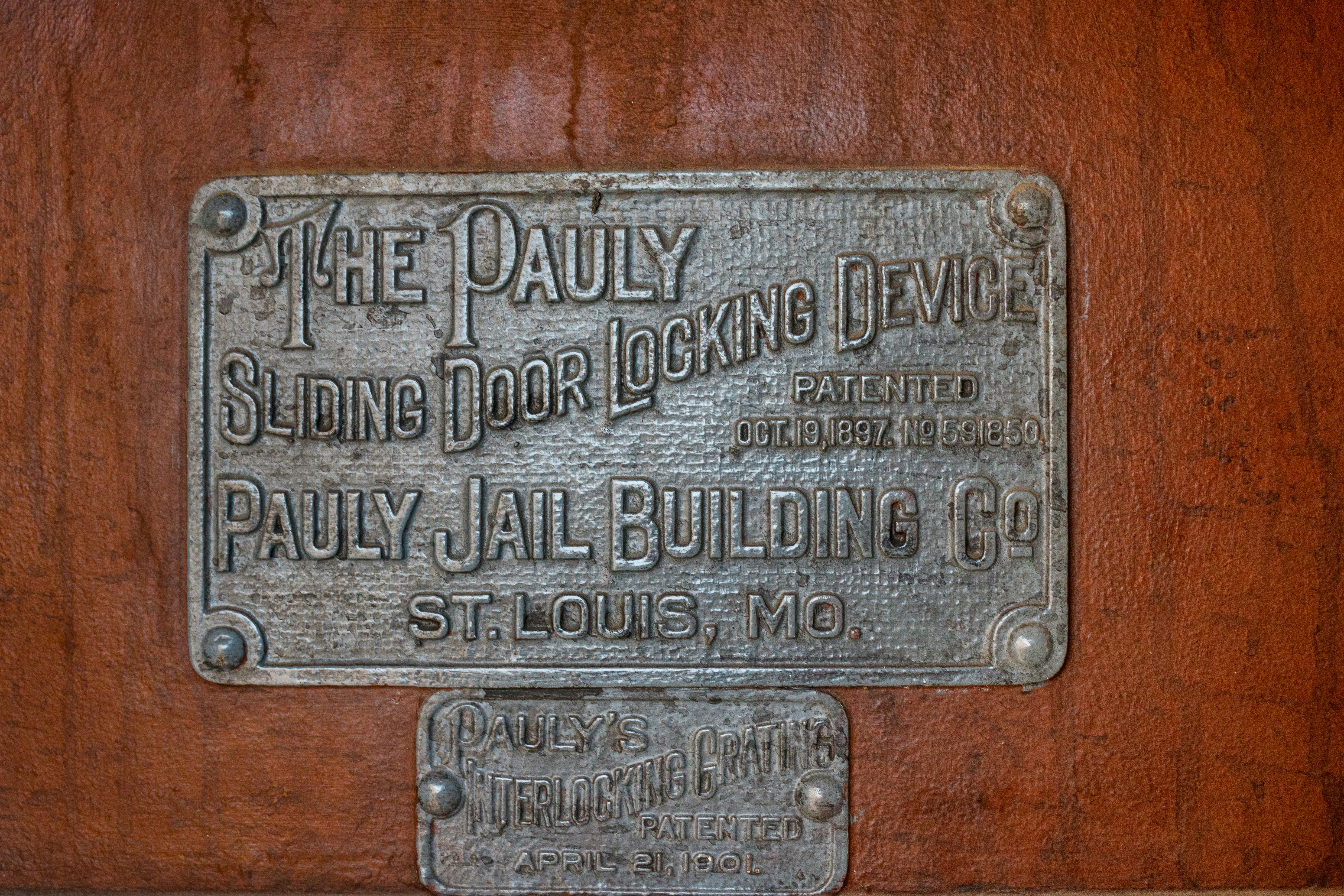 a plaque on the side of a wooden wall