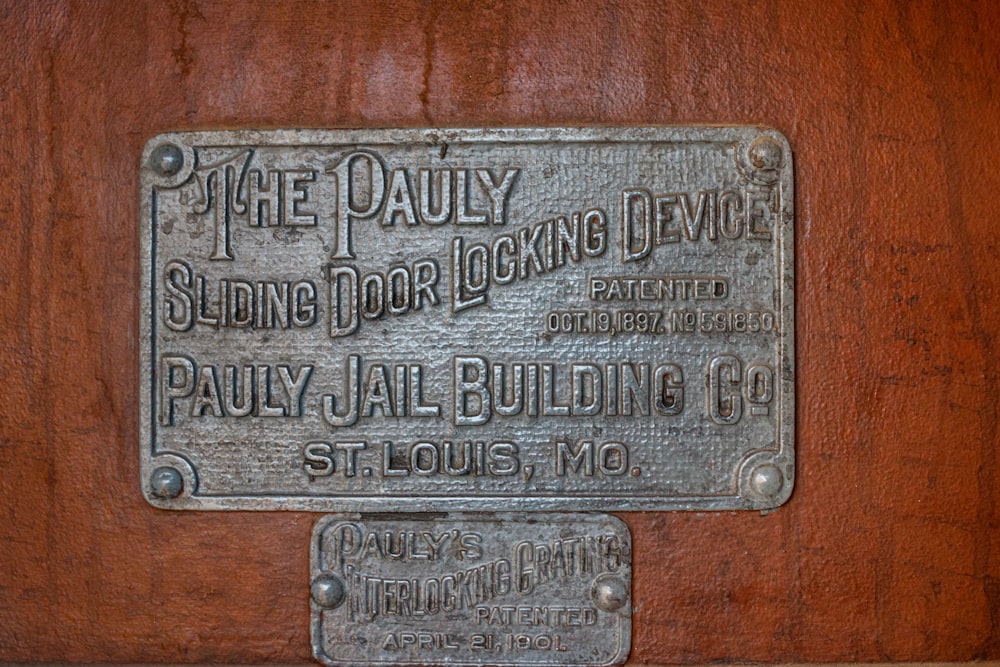 a plaque on the side of a wooden wall