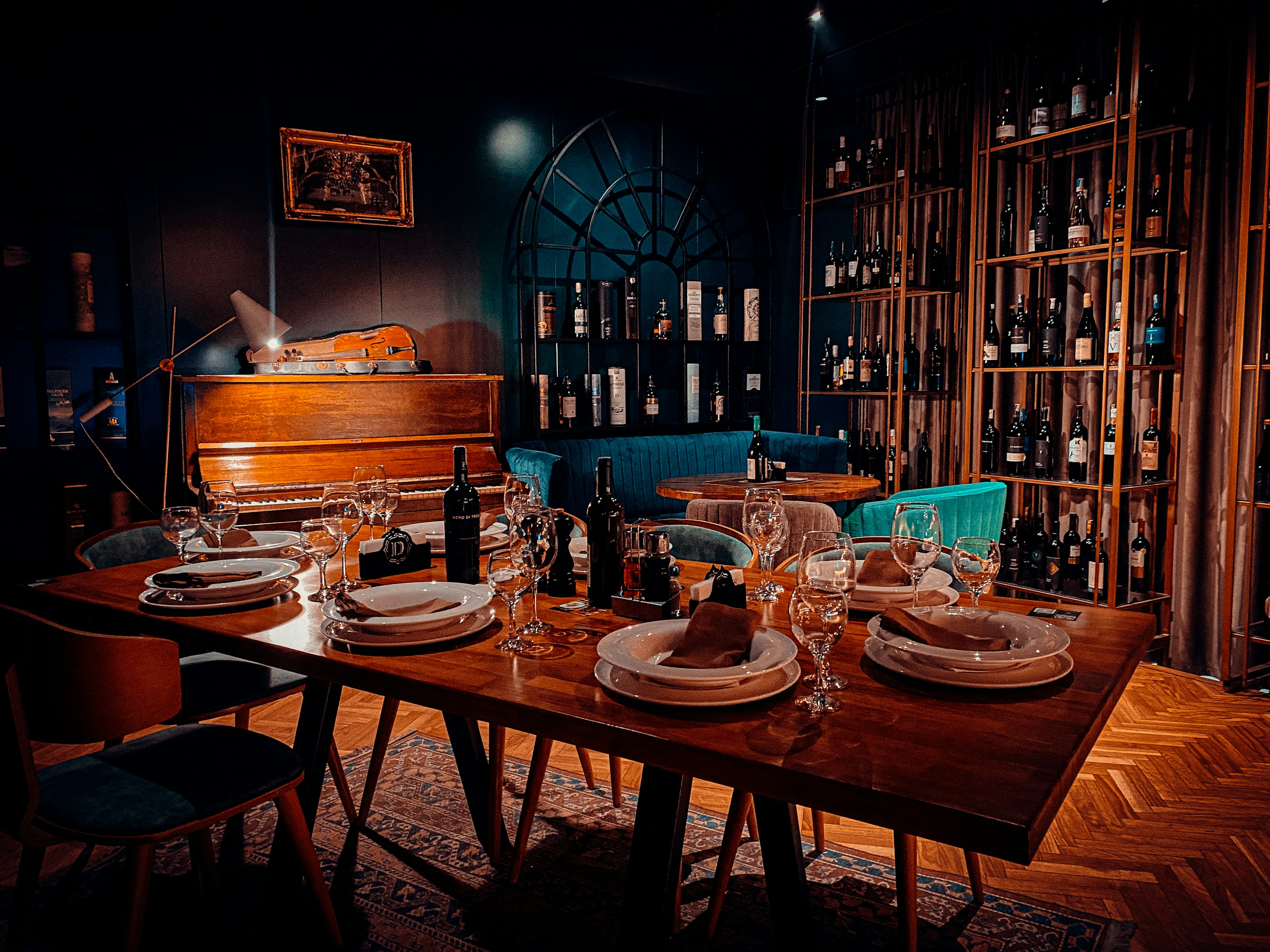 a dining room table set with place settings