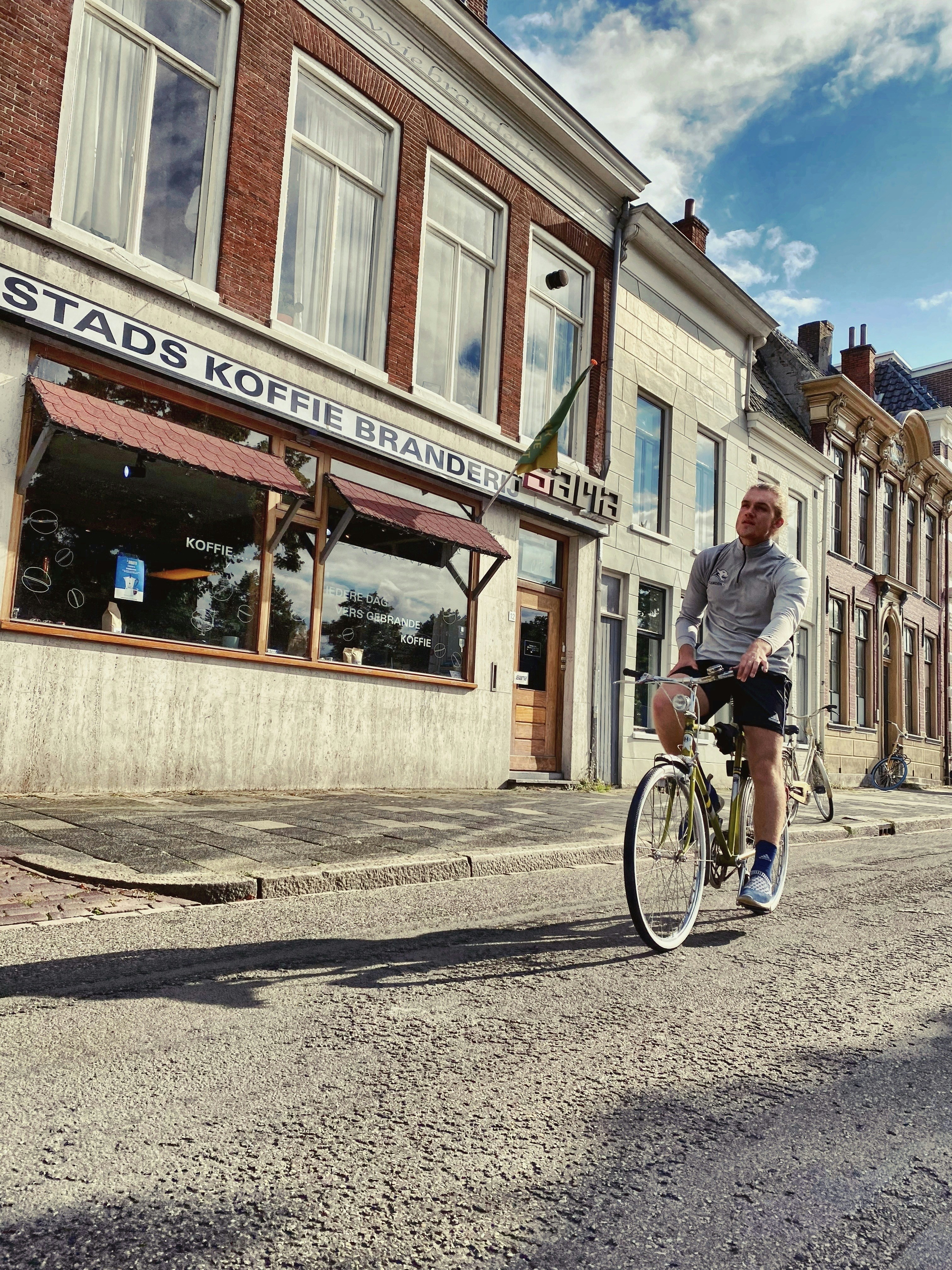 a man riding a bike down a street