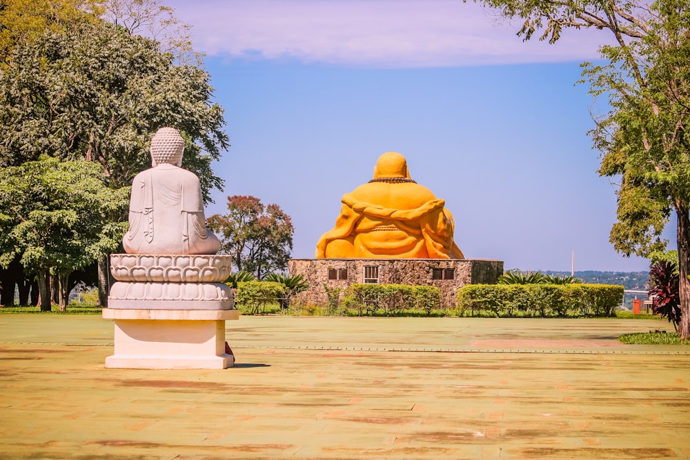 a large statue of a buddha in a park