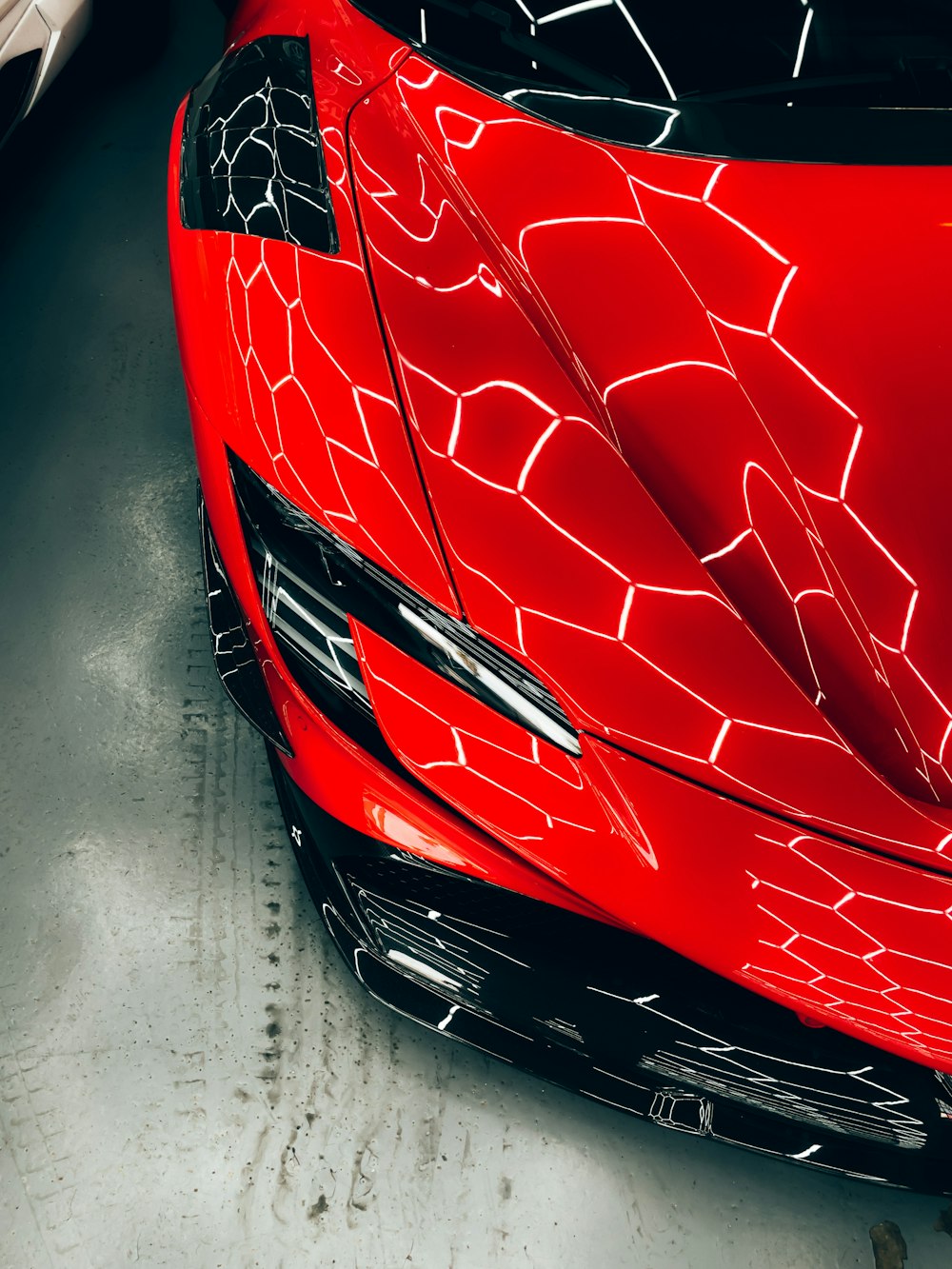 a red sports car parked in a garage