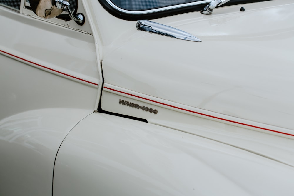 a close up of the side of a white car