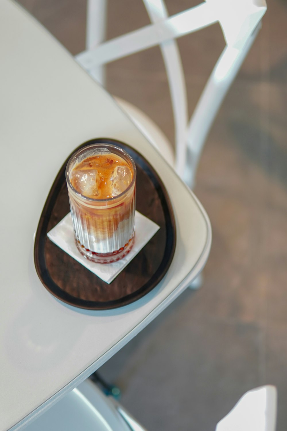 a drink sitting on top of a white table