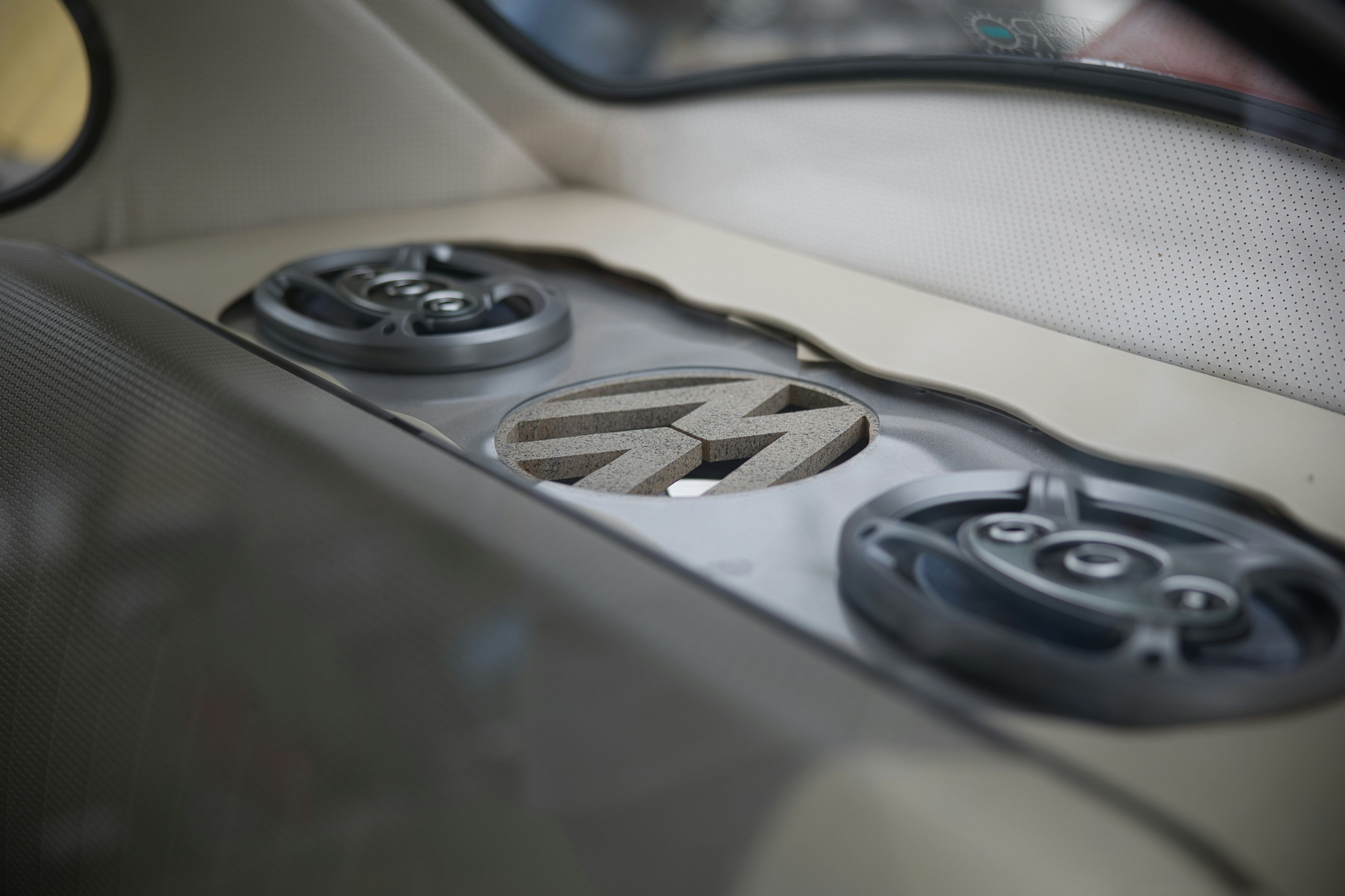 Premium electric sedan interior with large touchscreen and ambient lighting