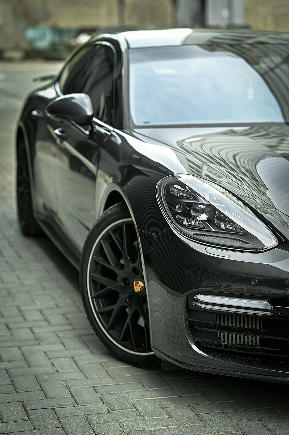 a black sports car parked on the side of the road