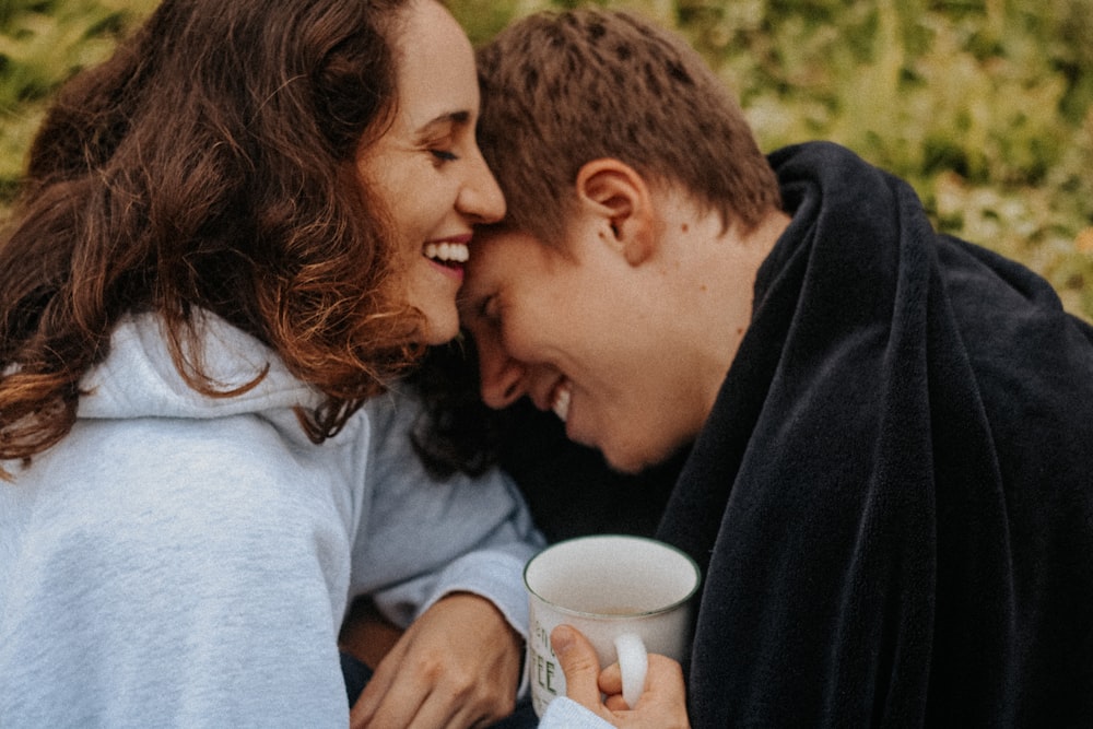 a man and a woman sitting next to each other