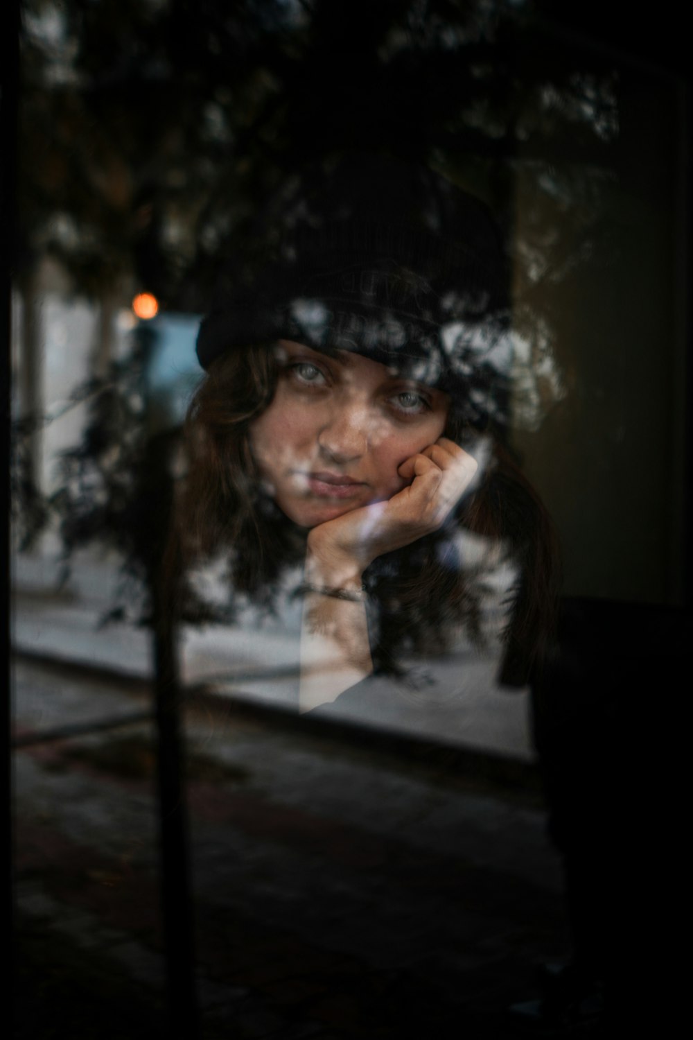 a reflection of a woman in a window
