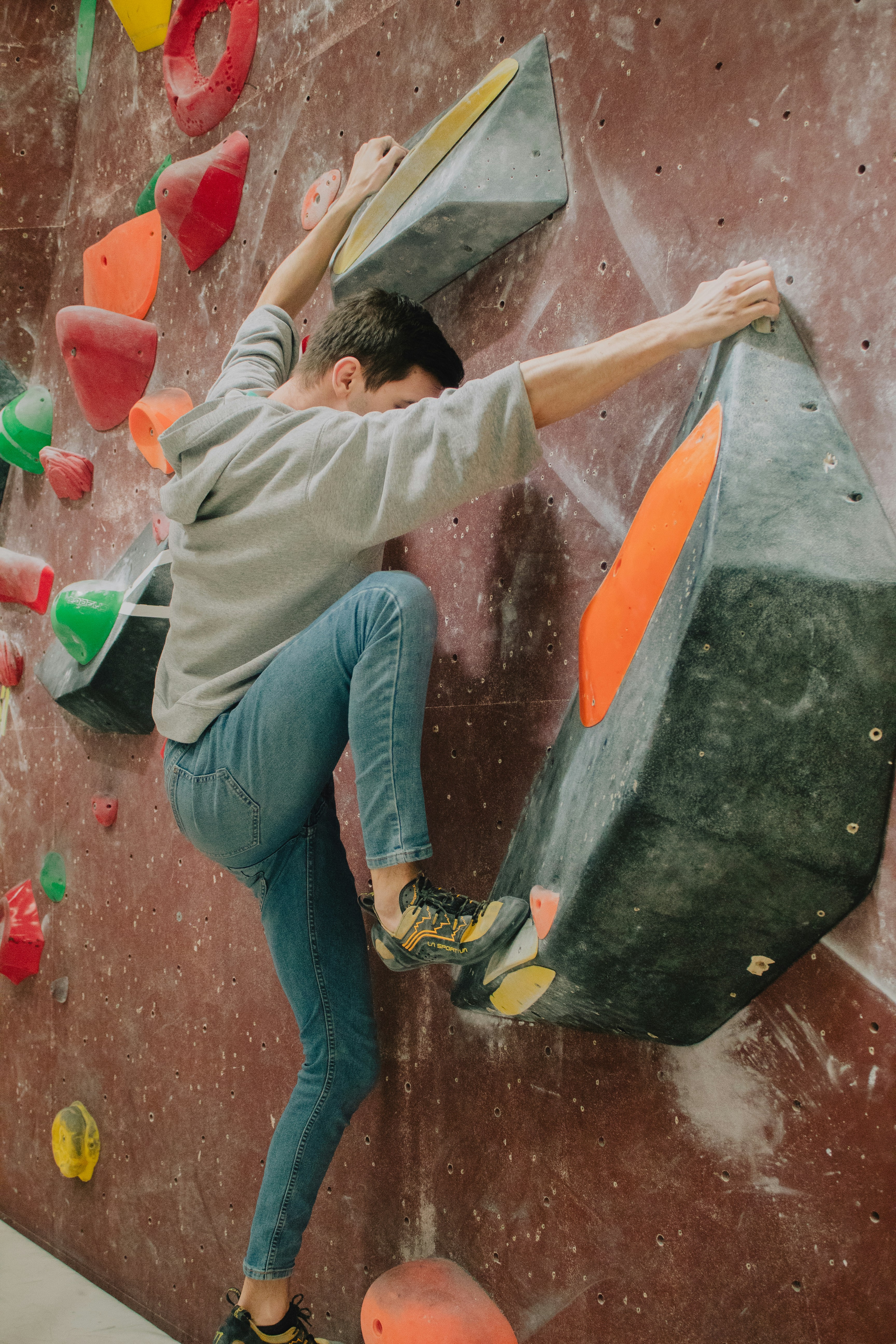 A climber moving up an indoor wall
