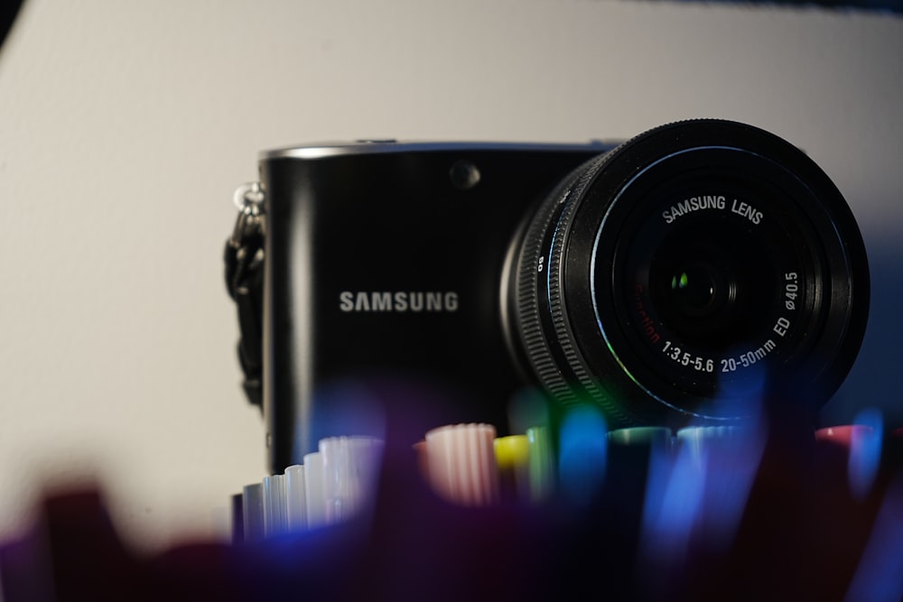 a black camera sitting on top of a table