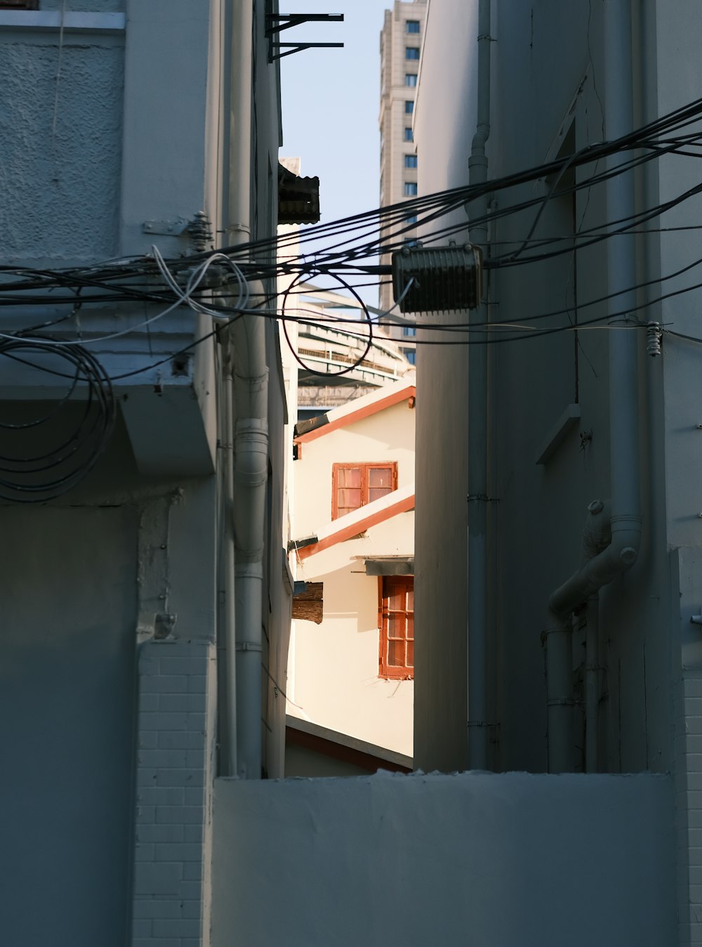 a view of a building through a narrow alley way
