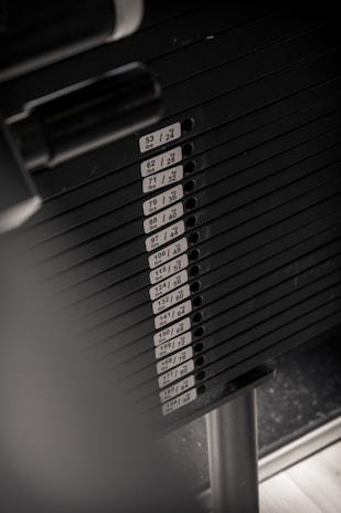 Stacked weights with the Absolute Fit logo subtly visible.