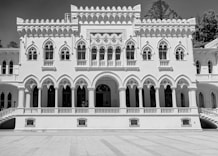 a large white building with many windows and balconies