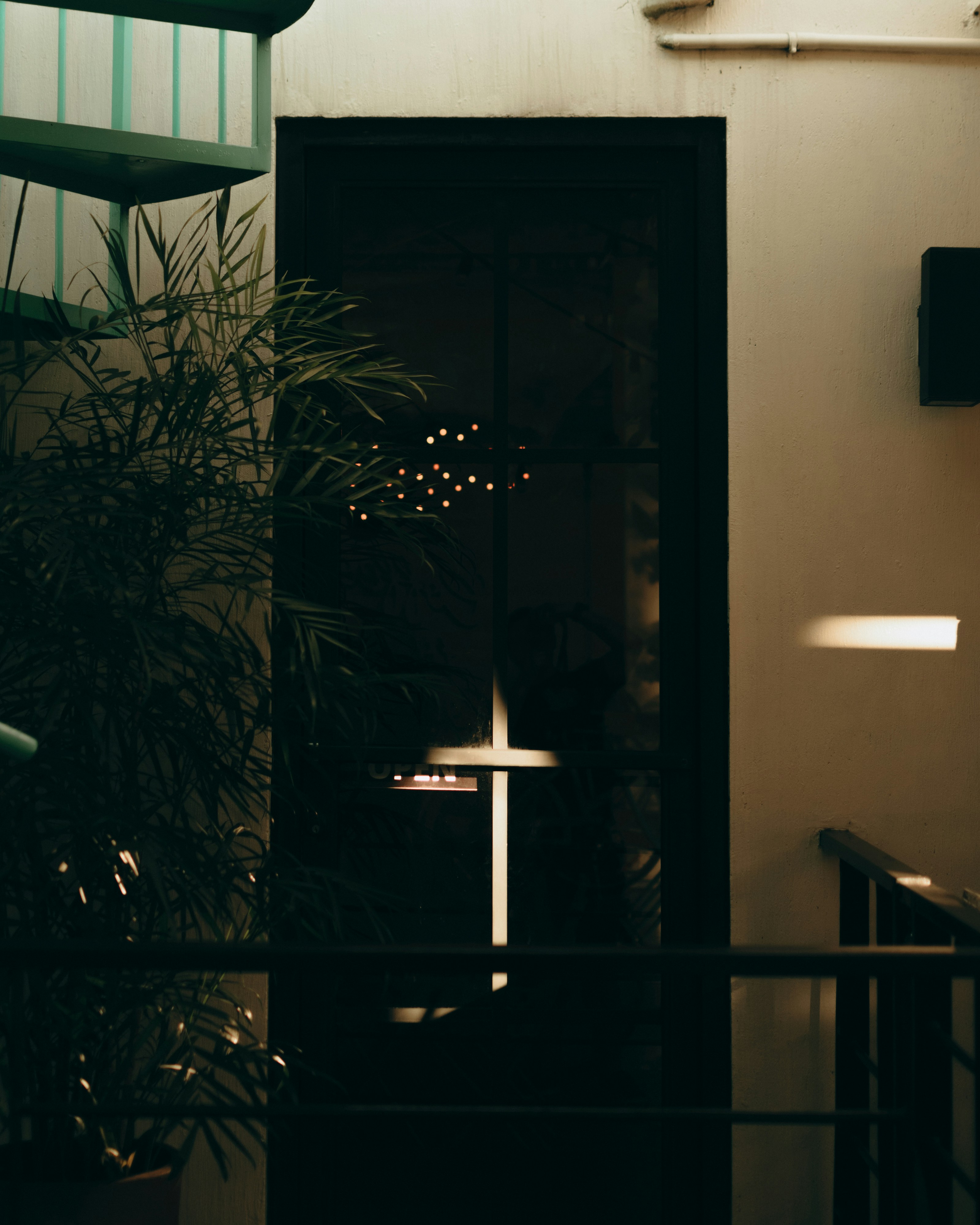 a dark room with a cross on the wall