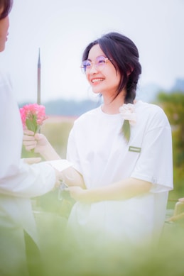 a woman holding a flower and a knife