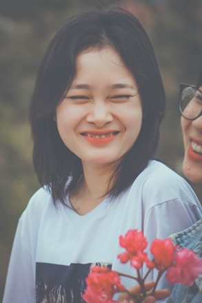 Happy person holding a winning Kerala lottery ticket with a bright smile.