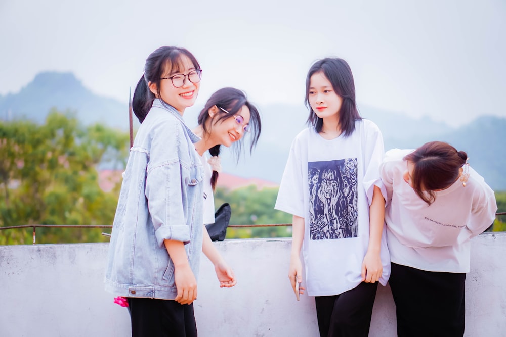 a group of young women standing next to each other