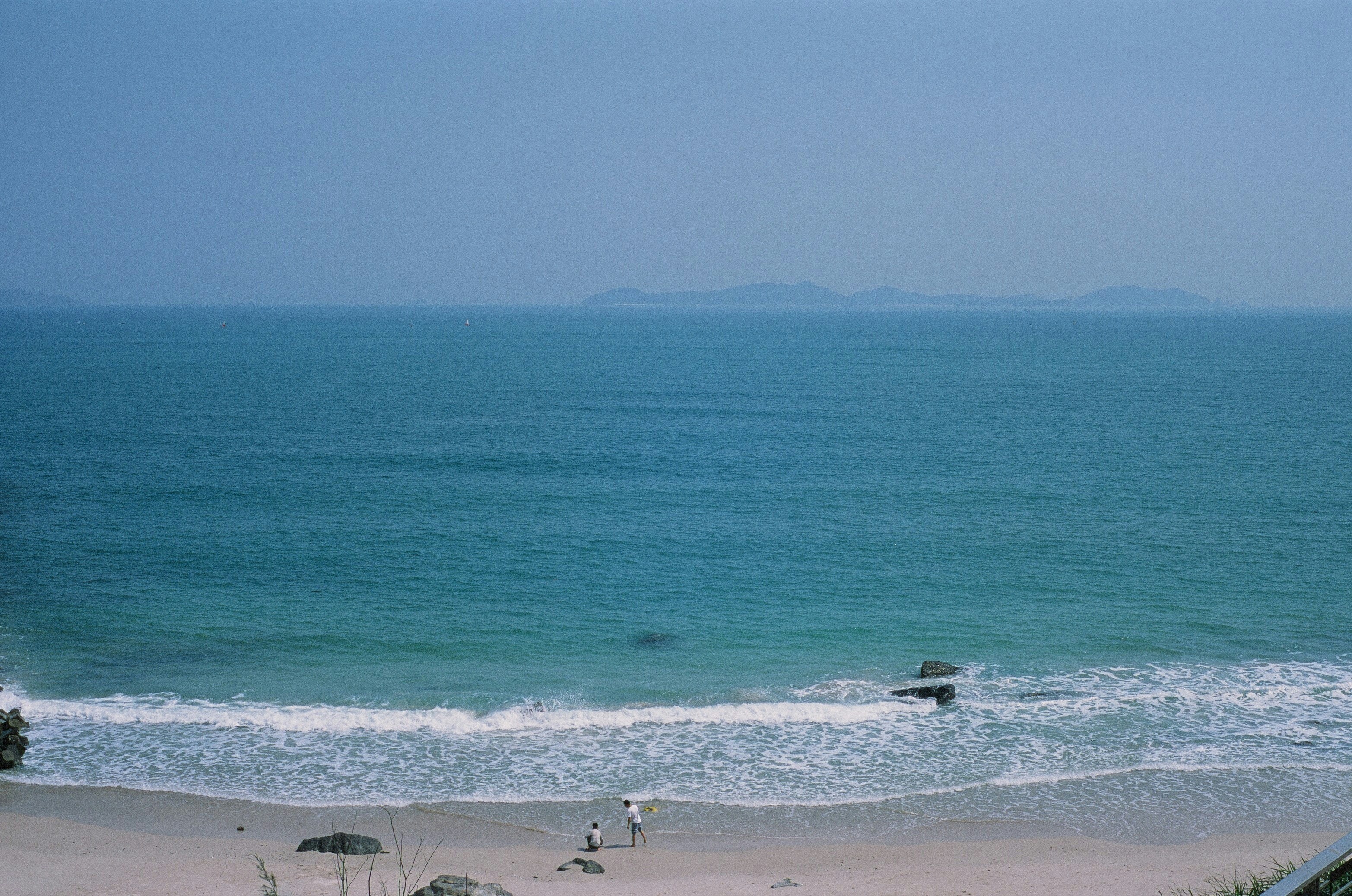 a view of the ocean from a hill top